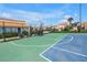 Community tennis and basketball court with green and blue playing surface at 4202 Harbor House Dr # 24, Tampa, FL 33615
