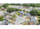 Wide shot of a suburban neighborhood featuring well-maintained lawns, mature trees, and proximity to community amenities at 4228 Belle Isle Ct, New Port Richey, FL 34653