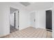 Bright hallway features tile flooring, neutral walls, and doorways leading to other rooms at 4228 Belle Isle Ct, New Port Richey, FL 34653