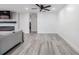 Bright and spacious living room with wood-look floors and modern electric fireplace at 4228 Belle Isle Ct, New Port Richey, FL 34653