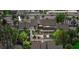 Aerial view of the building featuring screened in lanais and mature trees at 4777 Duhme Rd # 1D, St Petersburg, FL 33708