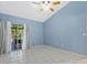 Bedroom with tile floor and sliding glass door to patio at 4777 Duhme Rd # 1D, St Petersburg, FL 33708