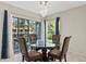 Dining room with table and chairs near sliding glass doors at 4777 Duhme Rd # 1D, St Petersburg, FL 33708