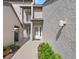 Inviting entryway featuring a white front door and well-maintained landscaping, adding curb appeal at 4777 Duhme Rd # 1D, St Petersburg, FL 33708