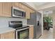 Well-equipped kitchen featuring stainless steel appliances and ample cabinetry at 4777 Duhme Rd # 1D, St Petersburg, FL 33708