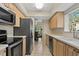 Bright kitchen with stainless steel appliances and tile flooring at 4777 Duhme Rd # 1D, St Petersburg, FL 33708