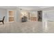 Bright living room with tile flooring, wet bar, and stairs to the second floor at 4777 Duhme Rd # 1D, St Petersburg, FL 33708