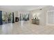 Open living room layout with a fireplace and sliding door access to the outdoors at 4777 Duhme Rd # 1D, St Petersburg, FL 33708