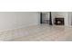 Spacious living area featuring tile flooring and a view of the fireplace at 4777 Duhme Rd # 1D, St Petersburg, FL 33708