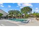 Community pool with lush landscaping and lounge chairs for relaxing in the Florida sunshine at 4777 Duhme Rd # 1D, St Petersburg, FL 33708