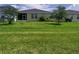 Spacious grassy backyard providing ample room for outdoor activities and relaxation at 5082 Inshore Landings Dr, Apollo Beach, FL 33572