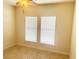Spacious bedroom with tile floors, ceiling fan and two bright windows at 5082 Inshore Landings Dr, Apollo Beach, FL 33572
