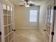 Bedroom showcasing French doors, a ceiling fan, and a window at 5082 Inshore Landings Dr, Apollo Beach, FL 33572