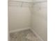 Walk-in closet with wire shelving and tiled floor provides ample storage space at 5082 Inshore Landings Dr, Apollo Beach, FL 33572