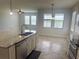 Bright, open kitchen features a large island with granite countertops and stainless steel appliances at 5082 Inshore Landings Dr, Apollo Beach, FL 33572