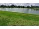 Picture of a pond with trees and green grass around the shoreline at 5082 Inshore Landings Dr, Apollo Beach, FL 33572