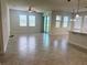 Open concept living room with multiple windows, lots of natural light, and tile flooring at 5082 Inshore Landings Dr, Apollo Beach, FL 33572