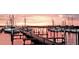 Picturesque marina scene at sunset featuring boats docked at the pier with colorful sky at 5082 Inshore Landings Dr, Apollo Beach, FL 33572