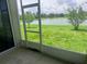 Enclosed patio with a view of the community lake at 5082 Inshore Landings Dr, Apollo Beach, FL 33572