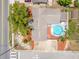 Overhead shot of a home with in-ground pool, hardscaped backyard, complemented by a detached garage and mature trees at 5236 Madison St, New Port Richey, FL 34652
