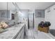Bathroom featuring a single sink with marble countertops and modern vanity lighting at 5236 Madison St, New Port Richey, FL 34652
