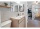 Well-maintained bathroom with a vanity and functional layout, providing necessary amenities at 5236 Madison St, New Port Richey, FL 34652