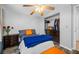 Comfortable bedroom with a closet, dresser, and well-organized closet storage at 5236 Madison St, New Port Richey, FL 34652