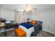A cozy bedroom featuring warm-toned decor, wood-look flooring, and a comfortable layout at 5236 Madison St, New Port Richey, FL 34652