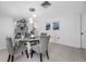 Dining area showcases glass table, upholstered chairs, and decorative mirrored display cabinet at 5236 Madison St, New Port Richey, FL 34652