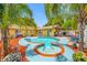 Gorgeous backyard with a pool, spa, and outdoor kitchen, perfect for entertaining guests at 5236 Madison St, New Port Richey, FL 34652