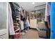A well-organized walk-in closet with ample storage for clothes, shoes, and accessories at 5236 Madison St, New Port Richey, FL 34652