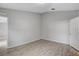 A light and airy bedroom with wood-look tile floor and a neutral color palette at 5396 Berrien Ave, Spring Hill, FL 34608