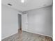 Wood-look flooring and neutral paint in this bright and airy bedroom at 5396 Berrien Ave, Spring Hill, FL 34608