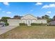Charming single-story home with a well-maintained lawn and an attached two-car garage at 5396 Berrien Ave, Spring Hill, FL 34608