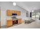 Open kitchen featuring modern appliances, ample counter space, and a breakfast bar at 5396 Berrien Ave, Spring Hill, FL 34608