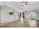 Open-concept living area featuring vaulted ceilings, tile floors, and natural light at 5396 Berrien Ave, Spring Hill, FL 34608
