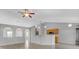 Spacious living room with archways, modern flooring, and a breakfast bar leading to the kitchen at 5396 Berrien Ave, Spring Hill, FL 34608