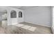 Spacious living room with wood floors and ample natural light shining through the windows at 5396 Berrien Ave, Spring Hill, FL 34608