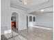 Open living space with wood floors and an arched doorway leading to another room at 5396 Berrien Ave, Spring Hill, FL 34608