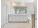 Large bathroom featuring double sinks, granite countertops, and walk in shower at 5430 Thistle Field Ct, Wesley Chapel, FL 33545