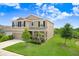Charming two-story home featuring a well-manicured lawn, inviting entrance, and attached two car garage at 5430 Thistle Field Ct, Wesley Chapel, FL 33545