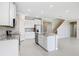 Well-lit kitchen with granite countertops, stainless steel appliances, and an adjacent dining area at 5430 Thistle Field Ct, Wesley Chapel, FL 33545