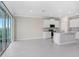 Open concept kitchen with granite countertops, stainless steel appliances, and white cabinetry at 5430 Thistle Field Ct, Wesley Chapel, FL 33545