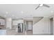 Modern kitchen with stainless steel appliances, granite countertops, and ample storage space at 5430 Thistle Field Ct, Wesley Chapel, FL 33545