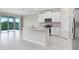 Modern kitchen with stainless appliances, a functional island, and white cabinets at 5430 Thistle Field Ct, Wesley Chapel, FL 33545