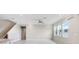Bright living room featuring tile flooring, ceiling fan, and multiple windows at 5430 Thistle Field Ct, Wesley Chapel, FL 33545