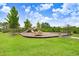 Community playground with slides and swings, providing a fun space for children to play at 5430 Thistle Field Ct, Wesley Chapel, FL 33545