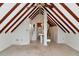 Finished attic room with exposed ceiling beams and a pedestal sink at 560 Bosphorous Ave, Tampa, FL 33606