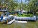 A wonderful Gathering backyard overlooking a serene canal with a dock for boating and relaxation at 560 Bosphorous Ave, Tampa, FL 33606
