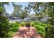Beautifully landscaped backyard with a well-maintained lawn and waterfront access with boat dock at 560 Bosphorous Ave, Tampa, FL 33606